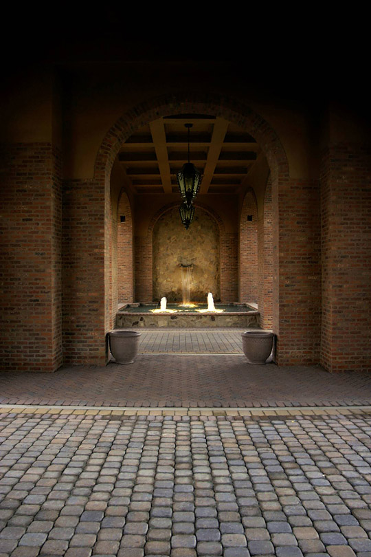 Concrete pavers achieve the look of traditional Spanish cobblestones.